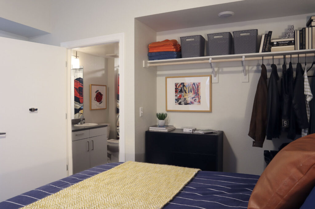 a bedroom with a bed and a dresser